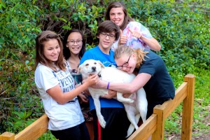 Members of TRYBE and a dog