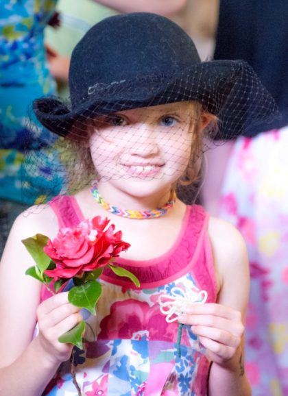 Girl in Hat with Flower