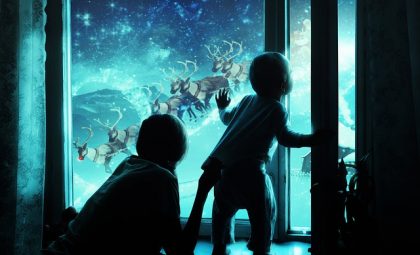 children gazing out the window at Santa's sleigh