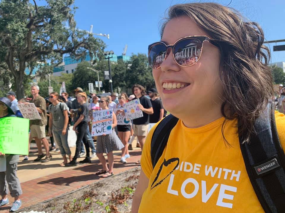 woman wearing yellow side of Love t-shirt 