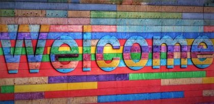Welcome on multi-colored wood panel